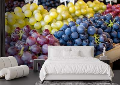 Vitis labrusca Concord Grapes a market setting a display of Concord grapes ready for sale emphasizing their rich flavor and juicy texture Wall mural