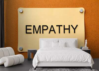 The word Empathy on a cork notice board isolated with white highlights, png Wall mural