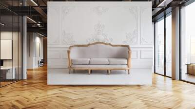 Luxurious bright Rococo interior with a large sofa and stucco on the walls. Selective focus. Wall mural