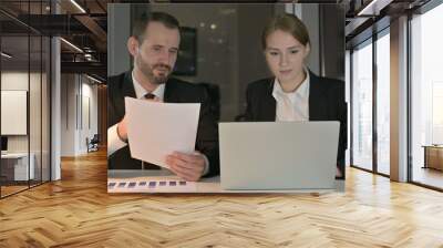 The Business people Working on Documents and Laptop at Night Wall mural