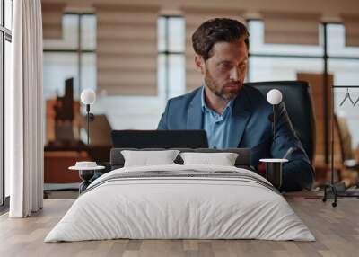 Businessman making work notes on papers at office desk closeup. Manager working Wall mural