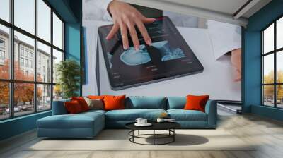 Doctor examining skull x-ray on tablet at hospital closeup. Physician hands Wall mural