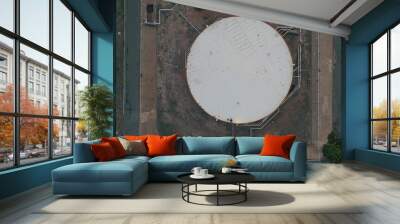 Oil storage tanks top view. Drone flying industrial facility with fossil fuel Wall mural