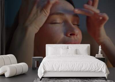 Woman making facial massage at evening apartment close up. Girl massaging face  Wall mural