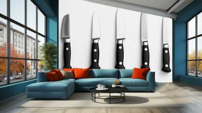 Set of five knives on a white background isolated kitchen utensils sharp stainless steel blades with black handles. Generative AI Wall mural