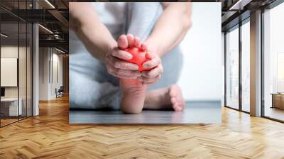 man with pain in foot Wall mural