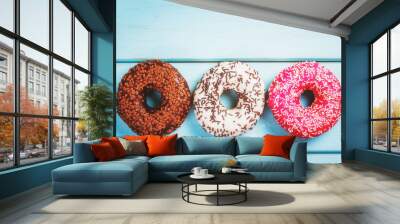 Sweet donuts on black stone table Wall mural