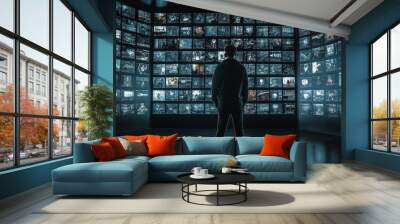 Handsome businessman standing in modern skyscraper, watching digital composite data generated by AI Wall mural