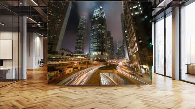 Lights streak of traffic with modern buildings in the city night. Wall mural