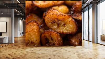 Deep fried ripe plantain slices or pake kele fried chips in a bowl Wall mural