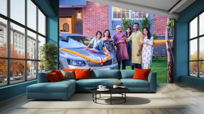 Indian asian family buys new car and standing for photograph wit Wall mural