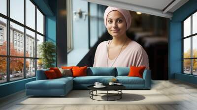 Indian confident bald woman in hospital who is a cancer survivor Wall mural