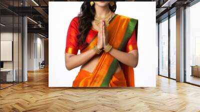 Indian pretty woman in saree in prayer pose or welcoming guests, isolated over white background Wall mural