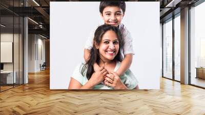 Indian pretty young mother and little boy or son embracing on white background Wall mural