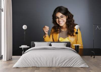 indian young woman with piggy bank Wall mural