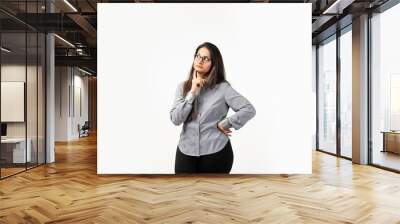 portrait of Indian beautiful woman thinking looking and smiling having a finger at her chin Wall mural