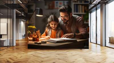 Young indian father helping school child daughter studying at home Wall mural