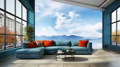 A detailed artwork depicting blue skies beautiful clouds mountains and a lake with copy space image Wall mural