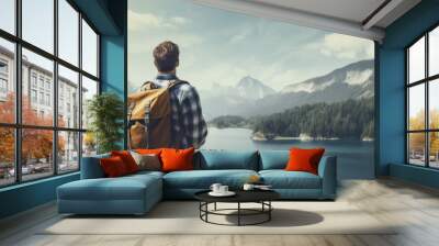 A man with a backpack admiring the scenic beauty of the lake in a copy space image Wall mural