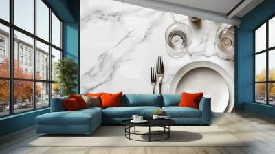 Elegant display on a white marble table featuring cutlery plate and room for text in a top down copy space image Wall mural