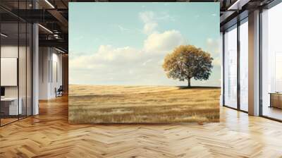 Lonely tree standing alone in an empty rural field with a vast expanse of beauty around it perfect for a copy space image Wall mural