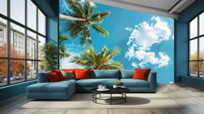 Sunny beach banner with coconut palm trees under a blue sky and clouds, ideal for summer vacation concepts, with room for text in the image. image with copy space Wall mural