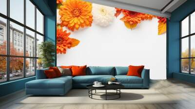 Top view of a fall themed flat lay with beautiful orange flowers on a white background creating an autumn inspired composition with ample copy space Wall mural