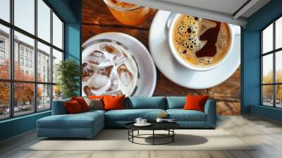 Top view of a refreshing ice coffee and a latte with tea on a wooden table in a cafe setting, presented on a white plate. Ideal for food and drink concepts with a copyspace image. Wall mural