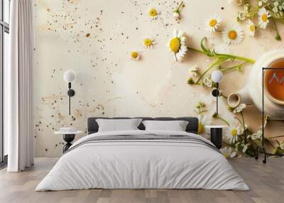 Top view of a white teapot with chamomile tea and buds on a beige surface alongside daisy flowers embodying a stylish eco friendly lifestyle with room for a copy space image Wall mural