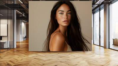 Young female model with natural skin texture, no makeup, and extra long straight hair Wall mural