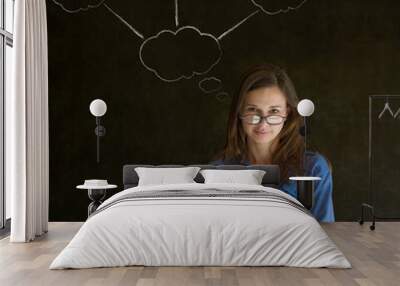 Thinking business woman with chalk cloud thoughts Wall mural