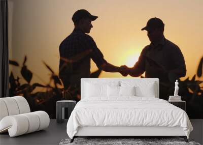 Two farmers talk on the field, then shake hands. Use a tablet Wall mural