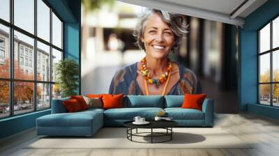 Portrait of happy senior woman smiling at the camera in the street Wall mural