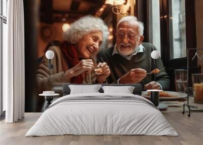 Senior couple eating pizza in cafe Wall mural