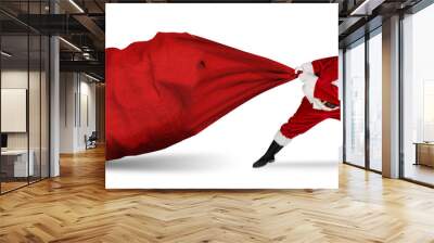 classic traditional crazy funny santa claus on exhausting delivery service. towing huge giant big red bag with christmas gift present  isolated  white background Wall mural