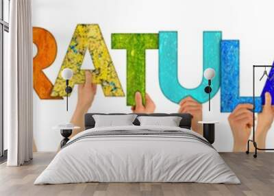 hands holding up colorful letters shaping the word congratulations isolated on white background Wall mural