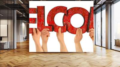 people holding up colorful red wooden letter with word welcome isolated white background. family reunion see meet gain arrival and you are welcome concept. Wall mural