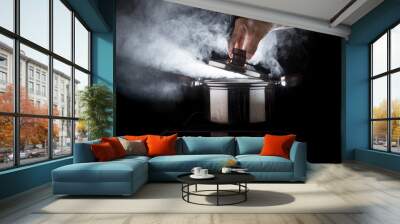 hand of chef open hot stream pot with beautiful studio lighting Wall mural