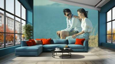 portrait of asian younger man and woman relaxing vacation at sea Wall mural