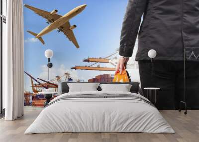 working man and commercial ship on port and air cargo plane flyi Wall mural