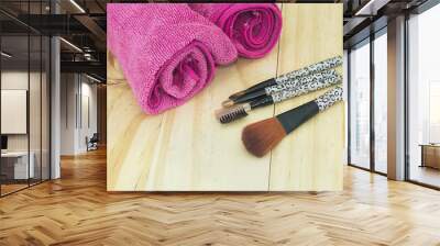 Set make up brushes with towl and wood background Wall mural