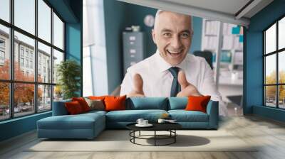 Cheerful executive giving a thumbs up Wall mural