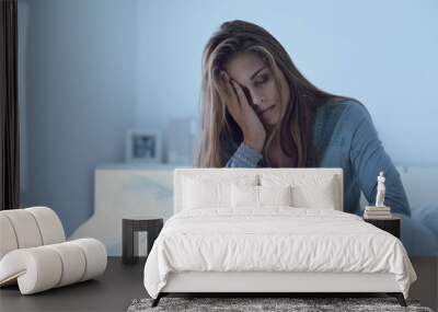 Depressed woman awake in the night Wall mural