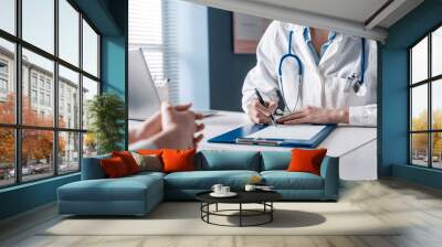 Doctor writing a medical prescription Wall mural