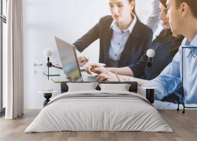 Professional business team working together at desk Wall mural