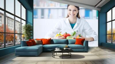 Smiling nutritionist in her office Wall mural