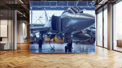 Military fighter jet in a hangar undergoing maintenance. High-tech plane in an aircraft hangar, ready for action. Wall mural