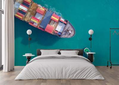 large container ship pulled into port by tugboats - top down aerial image Wall mural