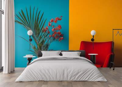 A vibrant room featuring a large plant in a white pot, an orange chair, and a two-tone wall in blue and orange. Wall mural