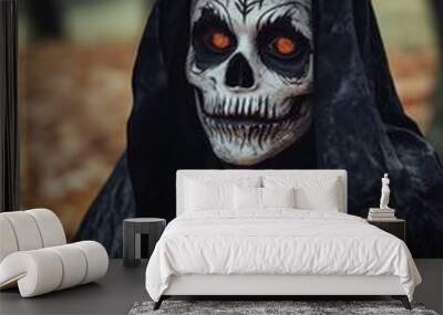 Figure wearing a skull mask and a dark cloak with glowing eyes, creating a chilling and ominous atmosphere. Wall mural